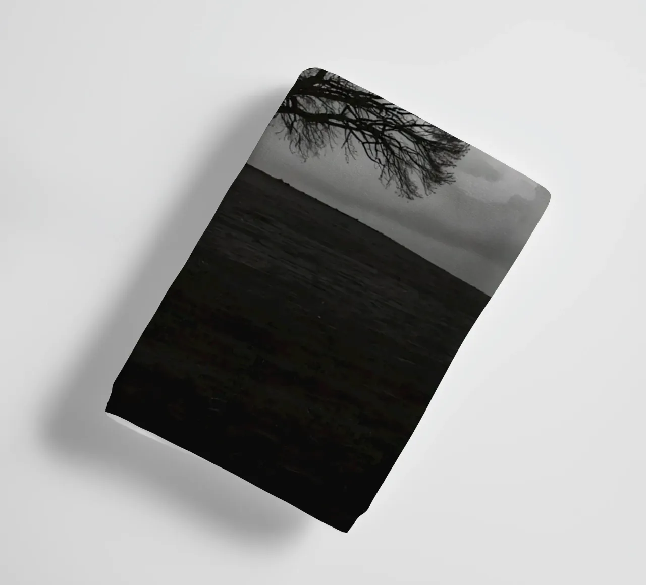 Deciduous Tree on Grassy Hill Under Cloudy Sky towel by DesignDoodle