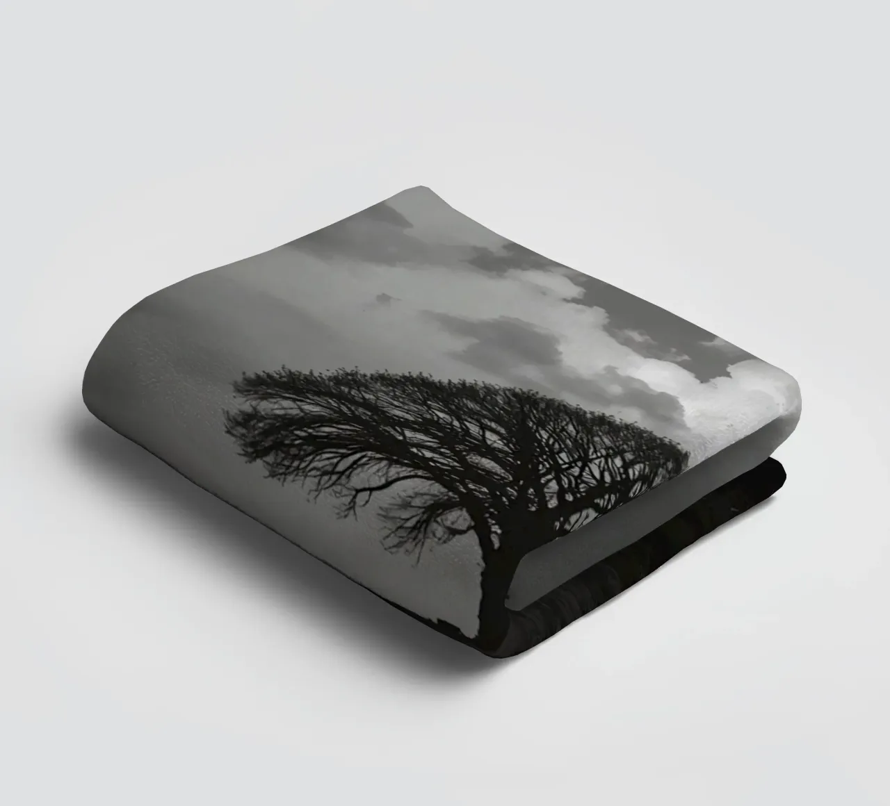 Deciduous Tree on Grassy Hill Under Cloudy Sky towel by DesignDoodle