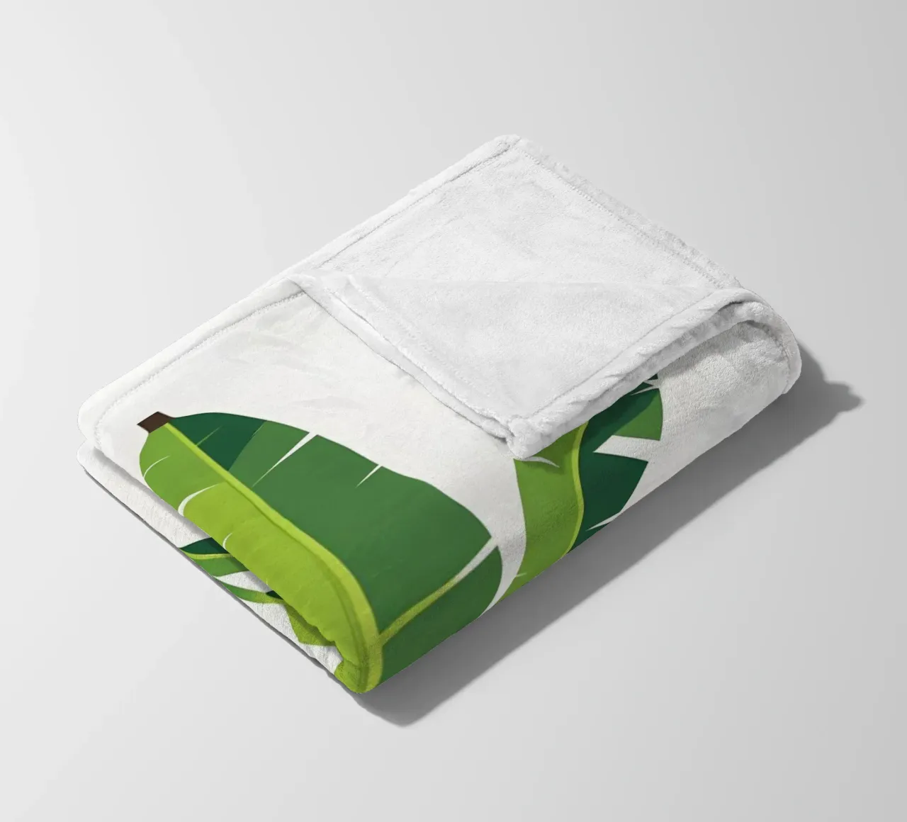 Section of banana leaf shape fleece blanket by Botanical Gallery