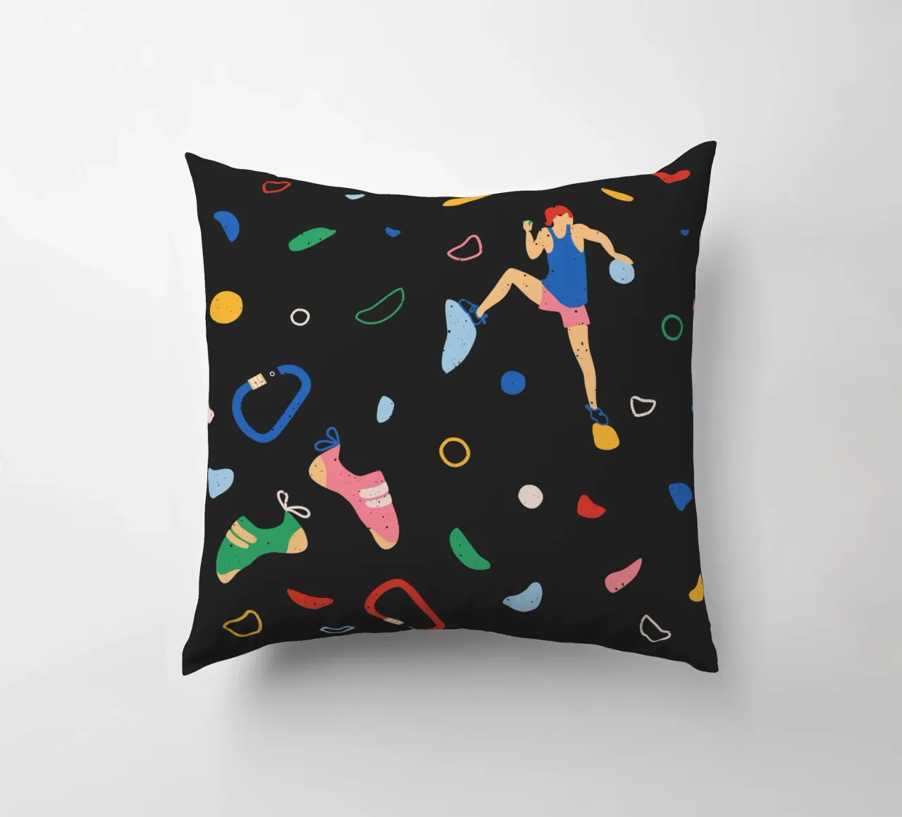 Arrampicatore su una parete di bouldering cuscino da justclimberthings