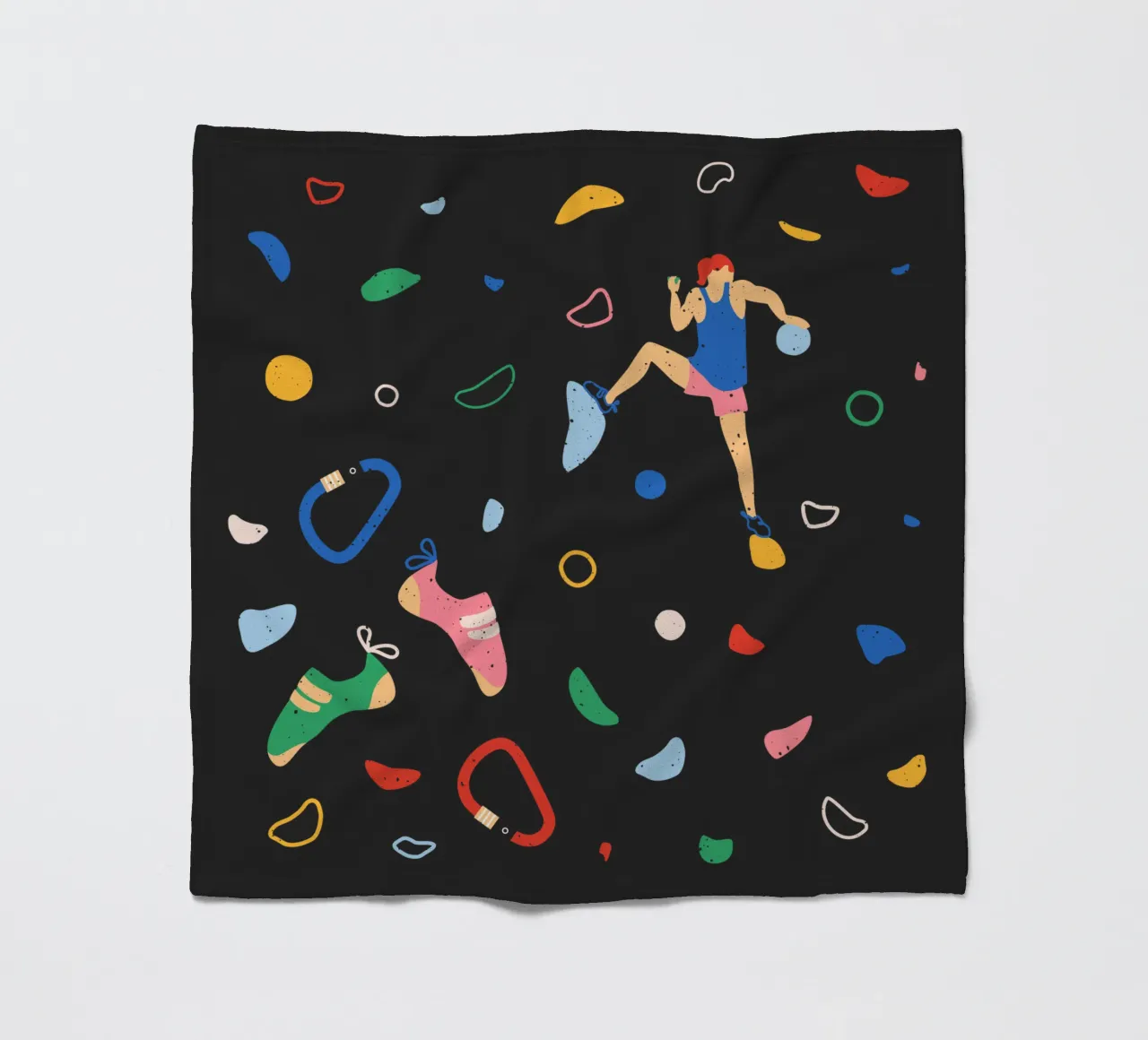 Arrampicatore su una parete di bouldering coperta in pile da justclimberthings