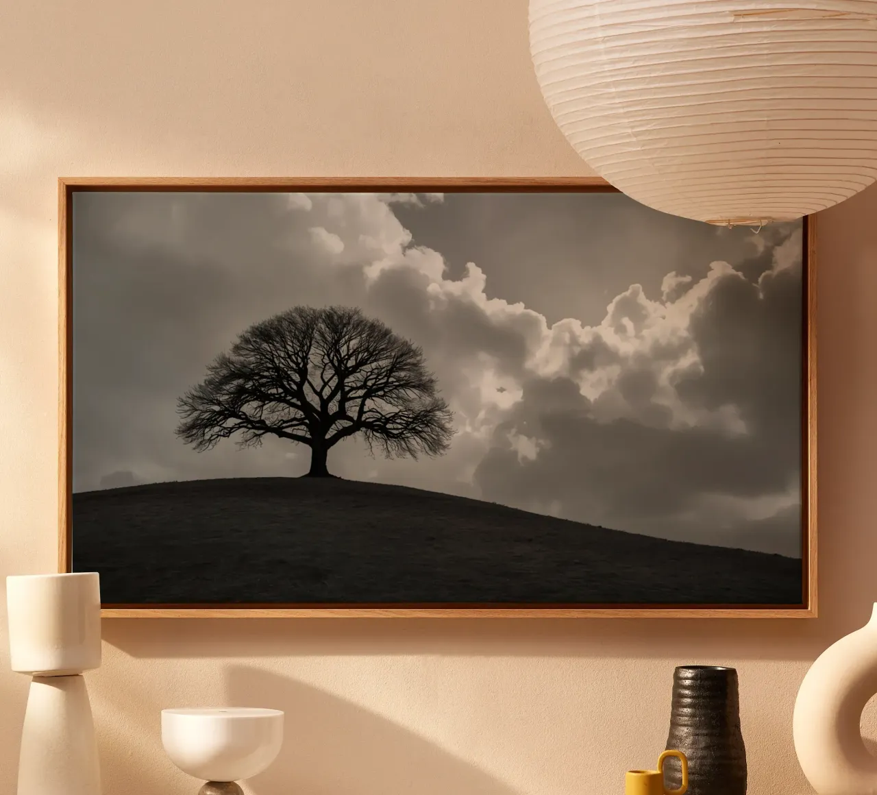 Silhouette of a bare tree on a hill against a cloudy sky canvas by DesignDoodle