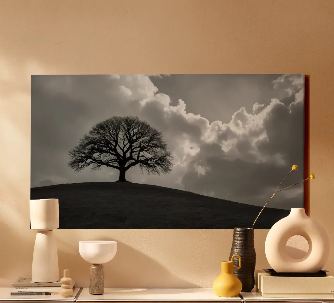 Silhouette of a bare tree on a hill against a cloudy sky canvas by DesignDoodle