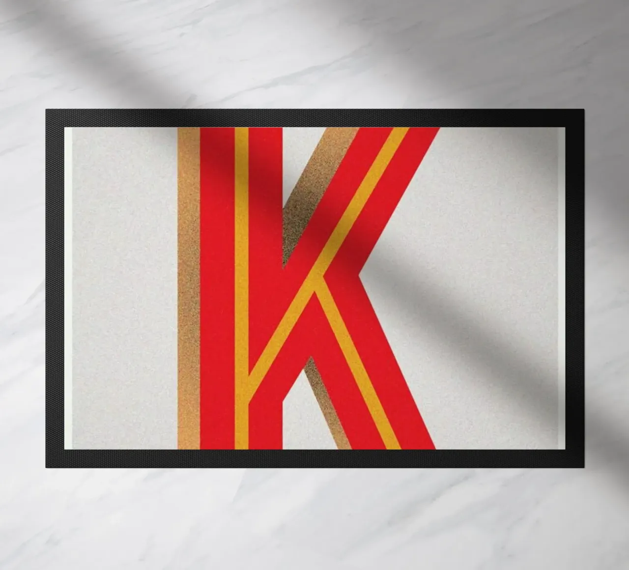 K deurmat van Andreas Jarner