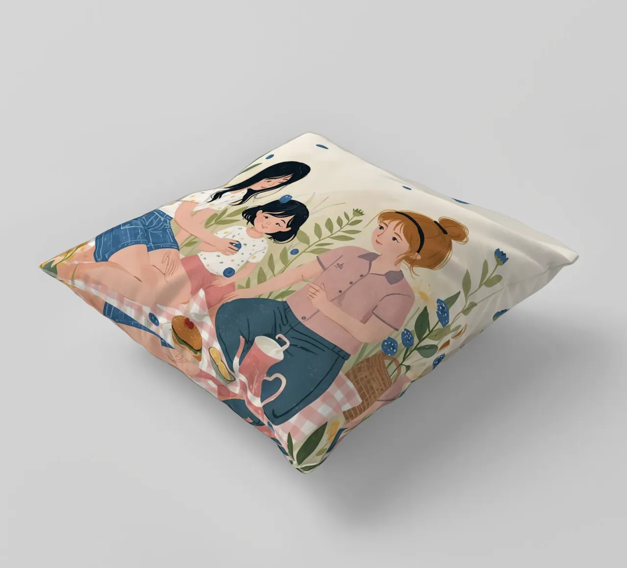 Una famiglia che si gode un picnic con cibo e fiori cuscino da DesignDoodle