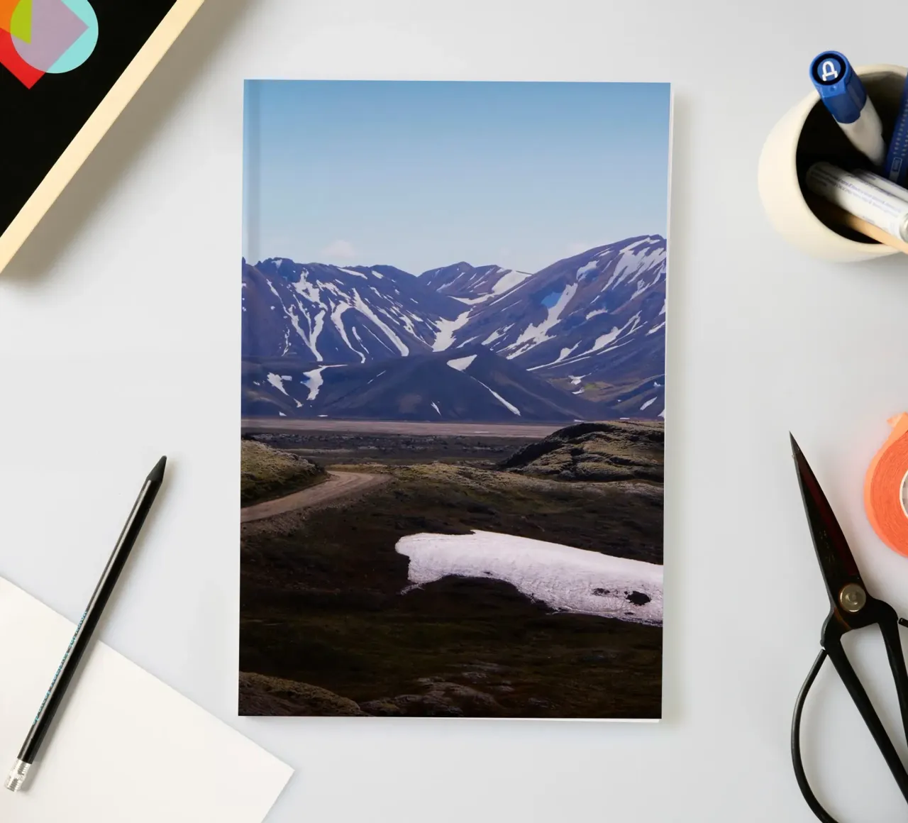 Road through epic mountain range notebook by Fjöllart