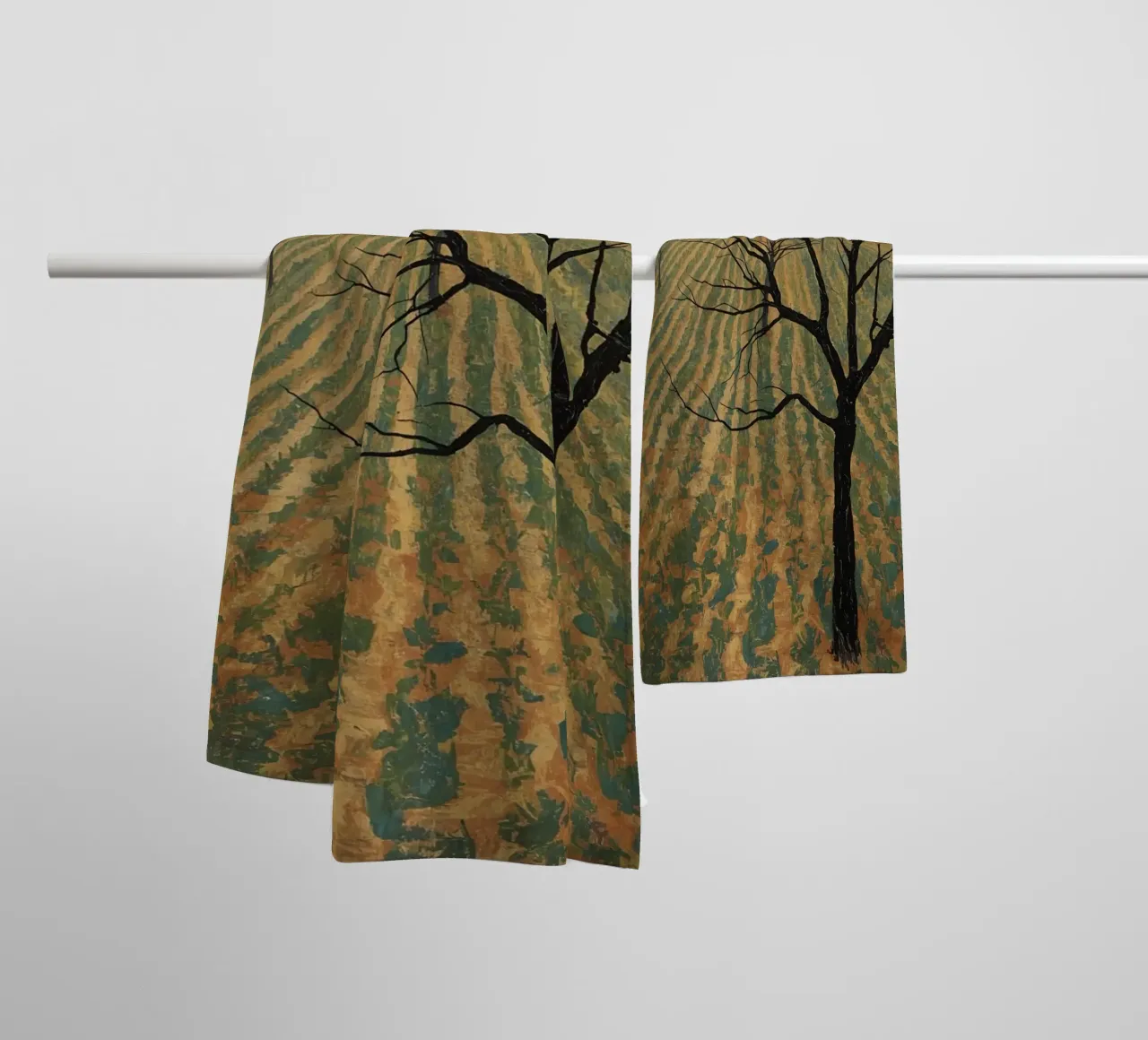 Bare Tree in Cultivated Field Under Golden Sky towel by DesignDoodle