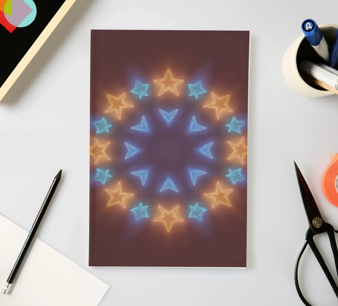 Circular arrangement of glowing stars and chevrons notebook by DesignDoodle