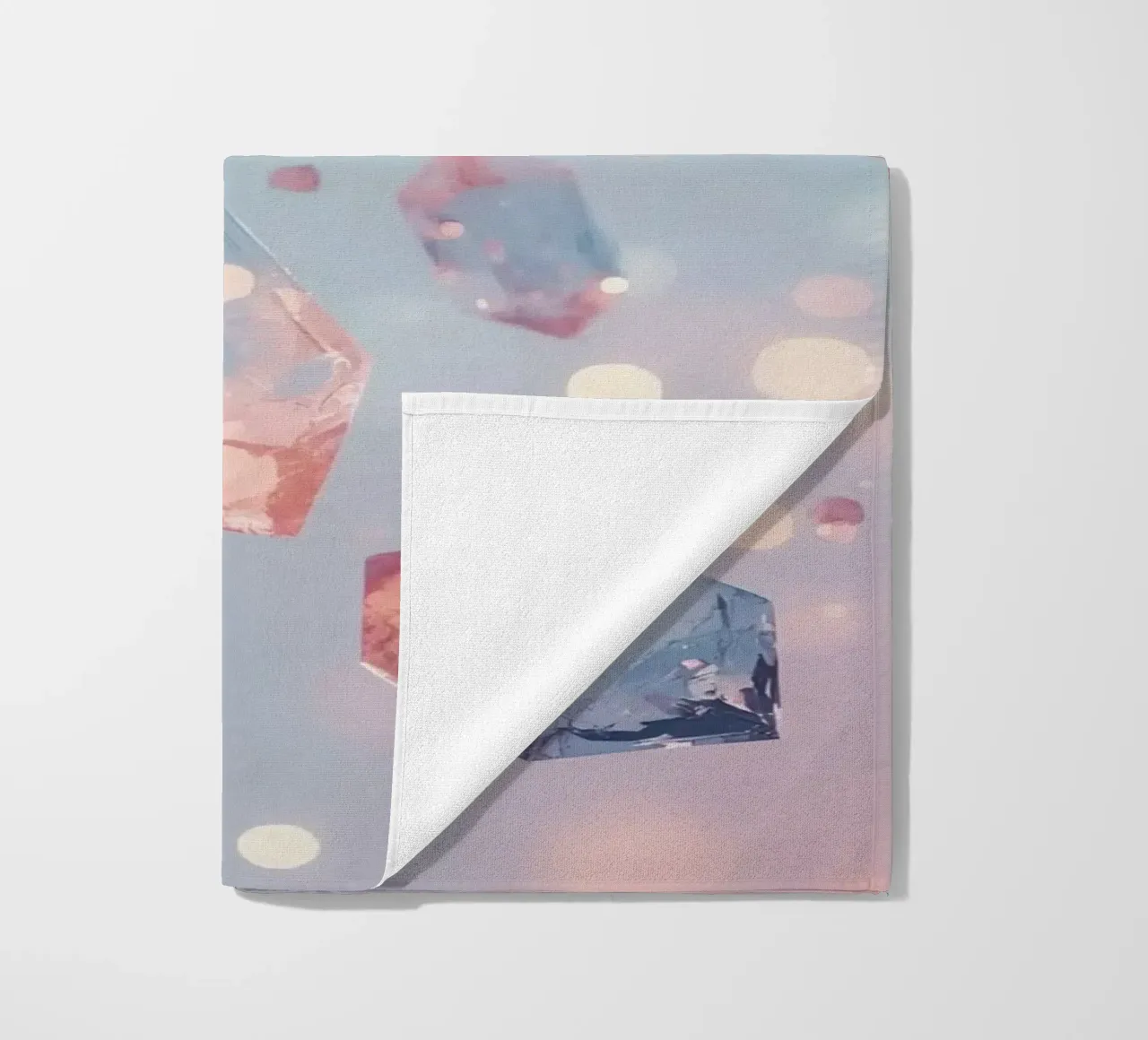 Floating crystals with bokeh background beach towel by DesignDoodle