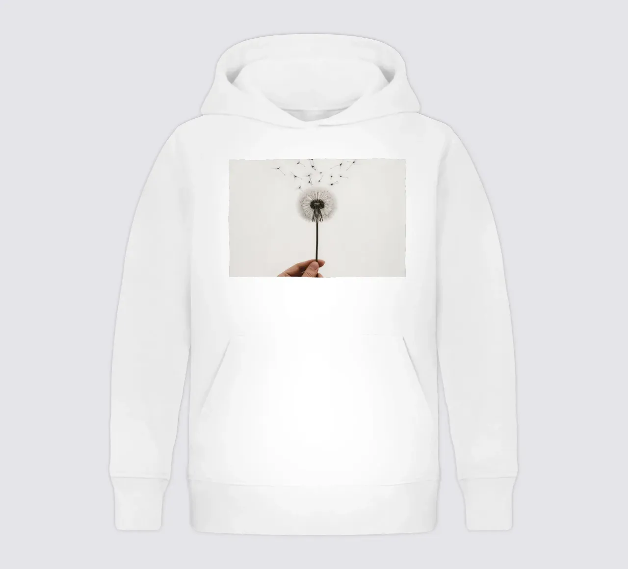 Mano que sostiene un diente de león con semillas voladoras sudadera con capucha para niño de DesignDoodle