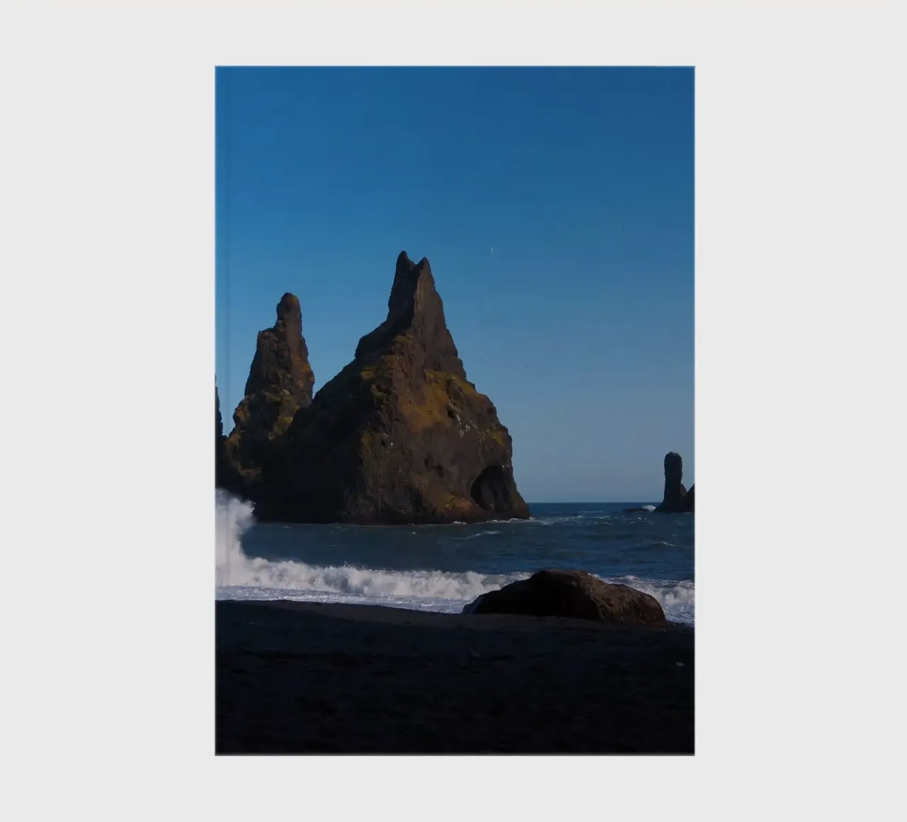 Rocks in the sea on Iceland's coast notebook by Fjöllart