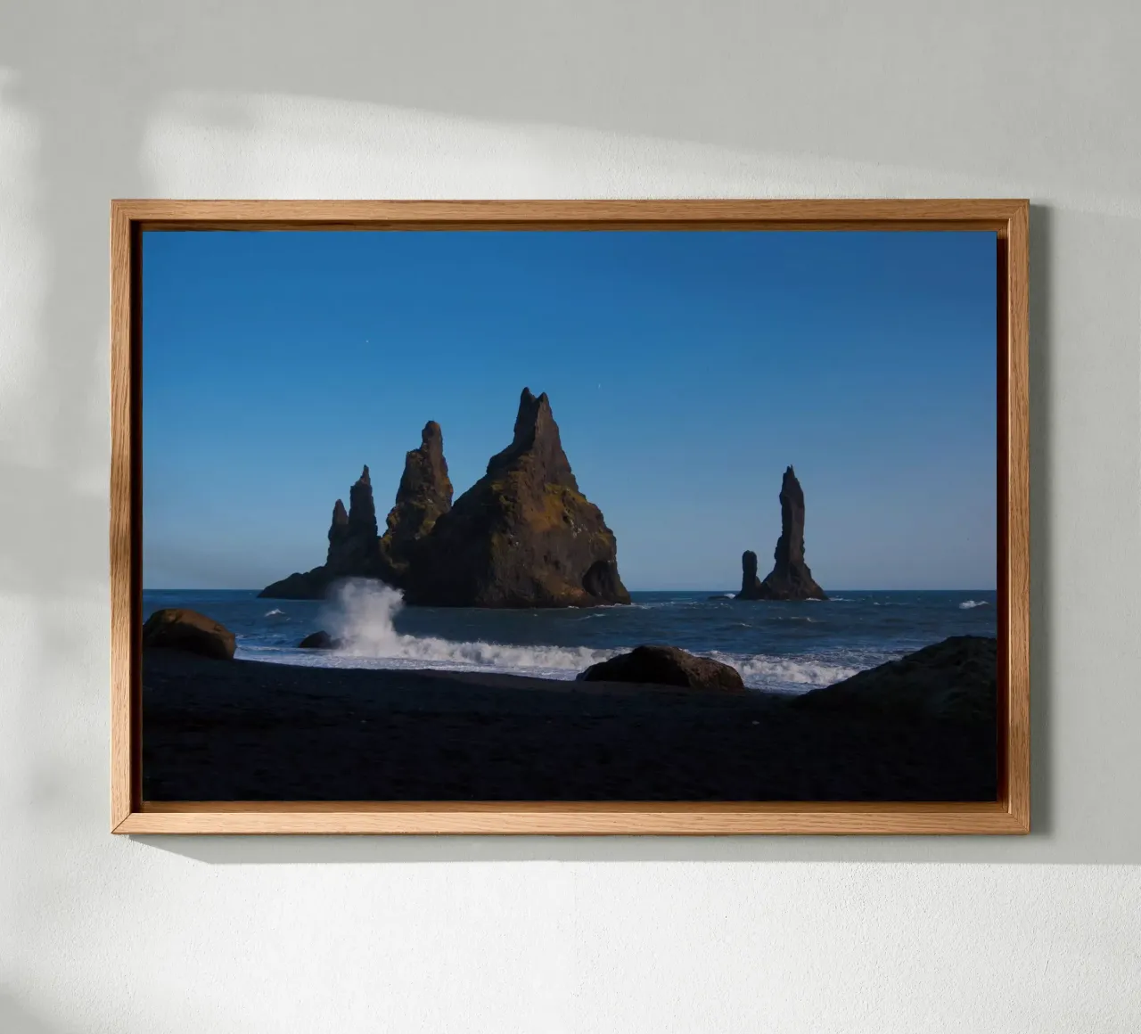Rocks in the sea on Iceland's coast canvas with Floater frame by Fjöllart