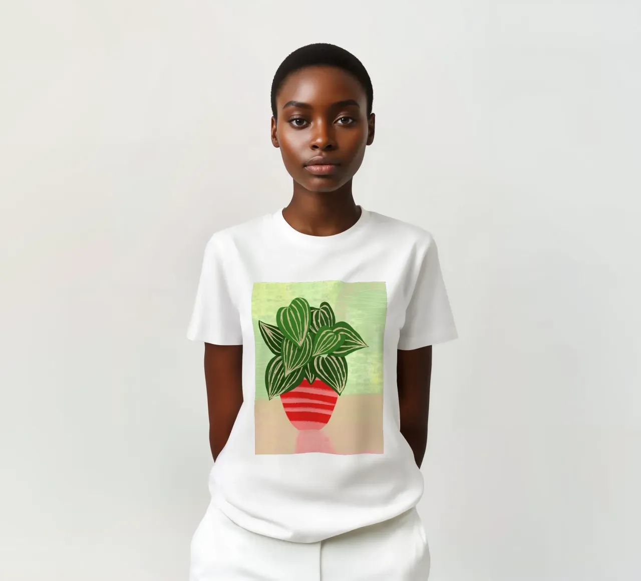 Pianta in vaso a foglia grande t-shirt da Kim Hubball Studio