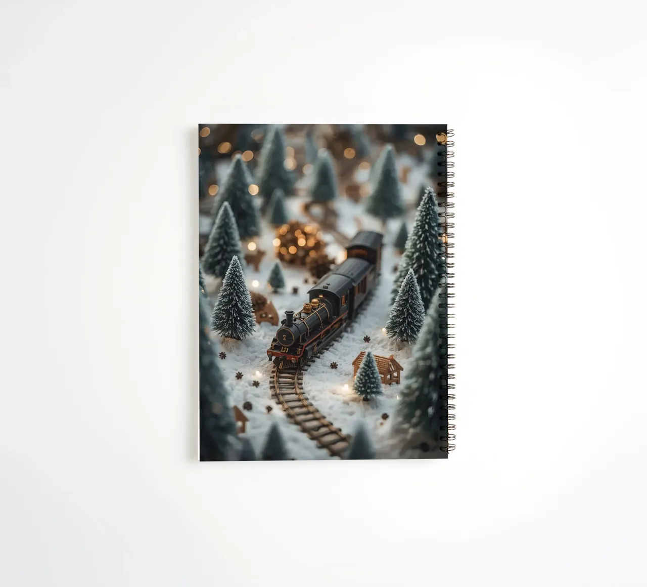 Miniature Train in Snowy Landscape with Trees and Lights spiral notebook by DesignDoodle