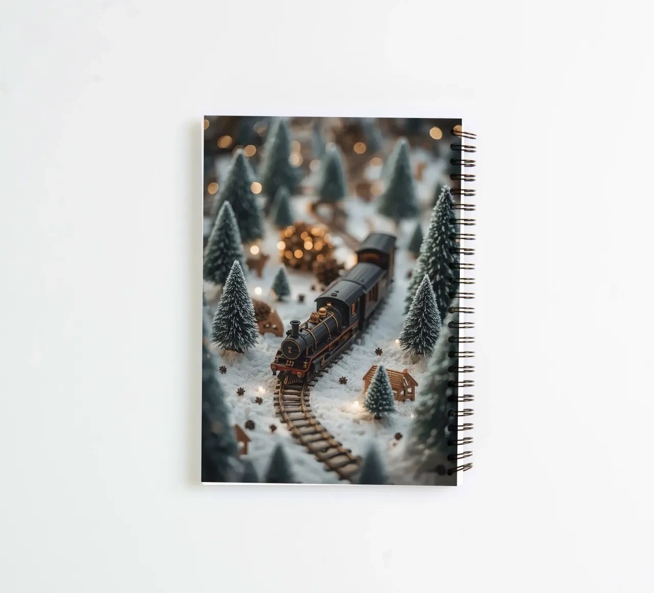Miniature Train in Snowy Landscape with Trees and Lights spiral notebook by DesignDoodle