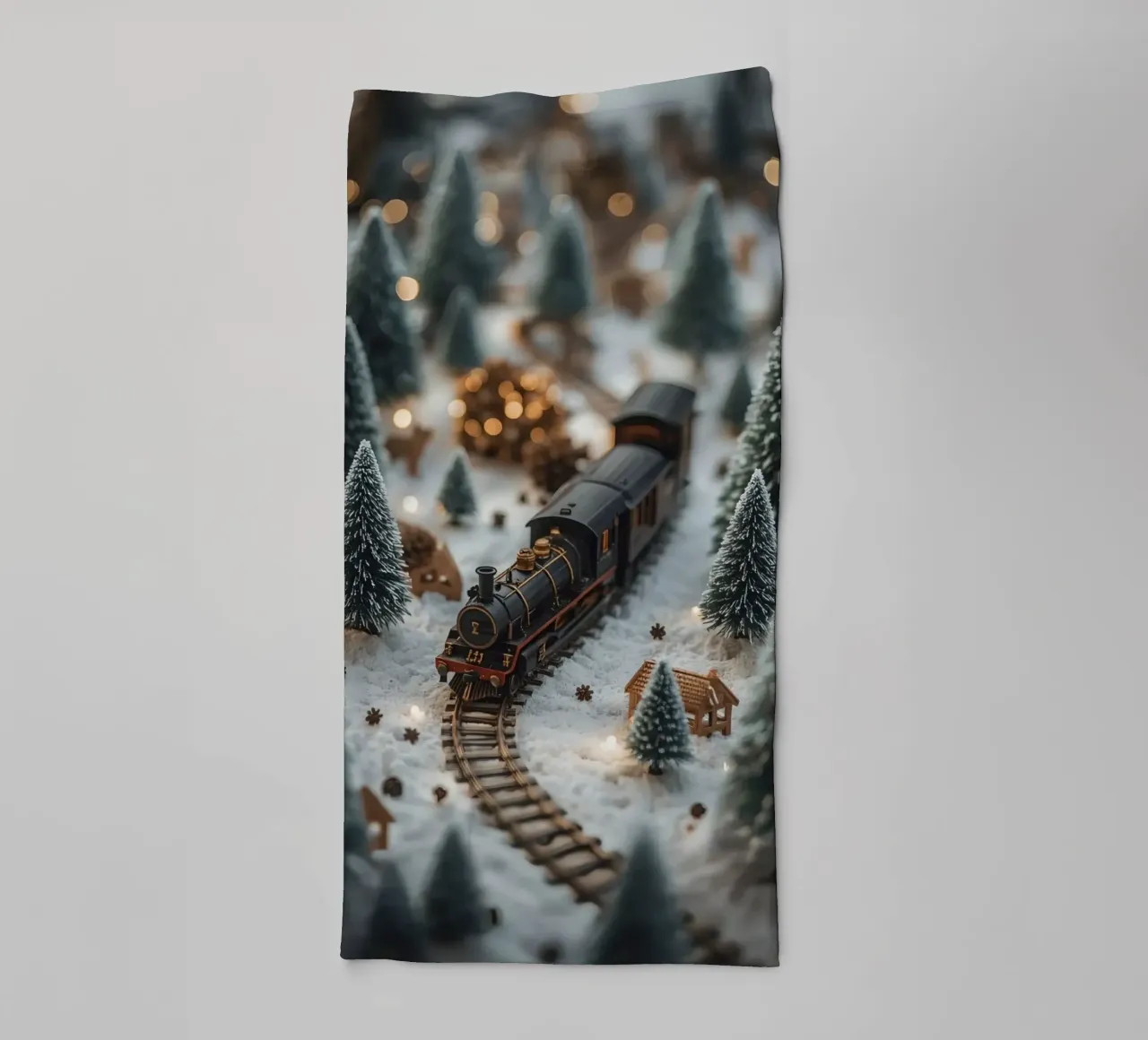 Miniature Train in Snowy Landscape with Trees and Lights towel by DesignDoodle