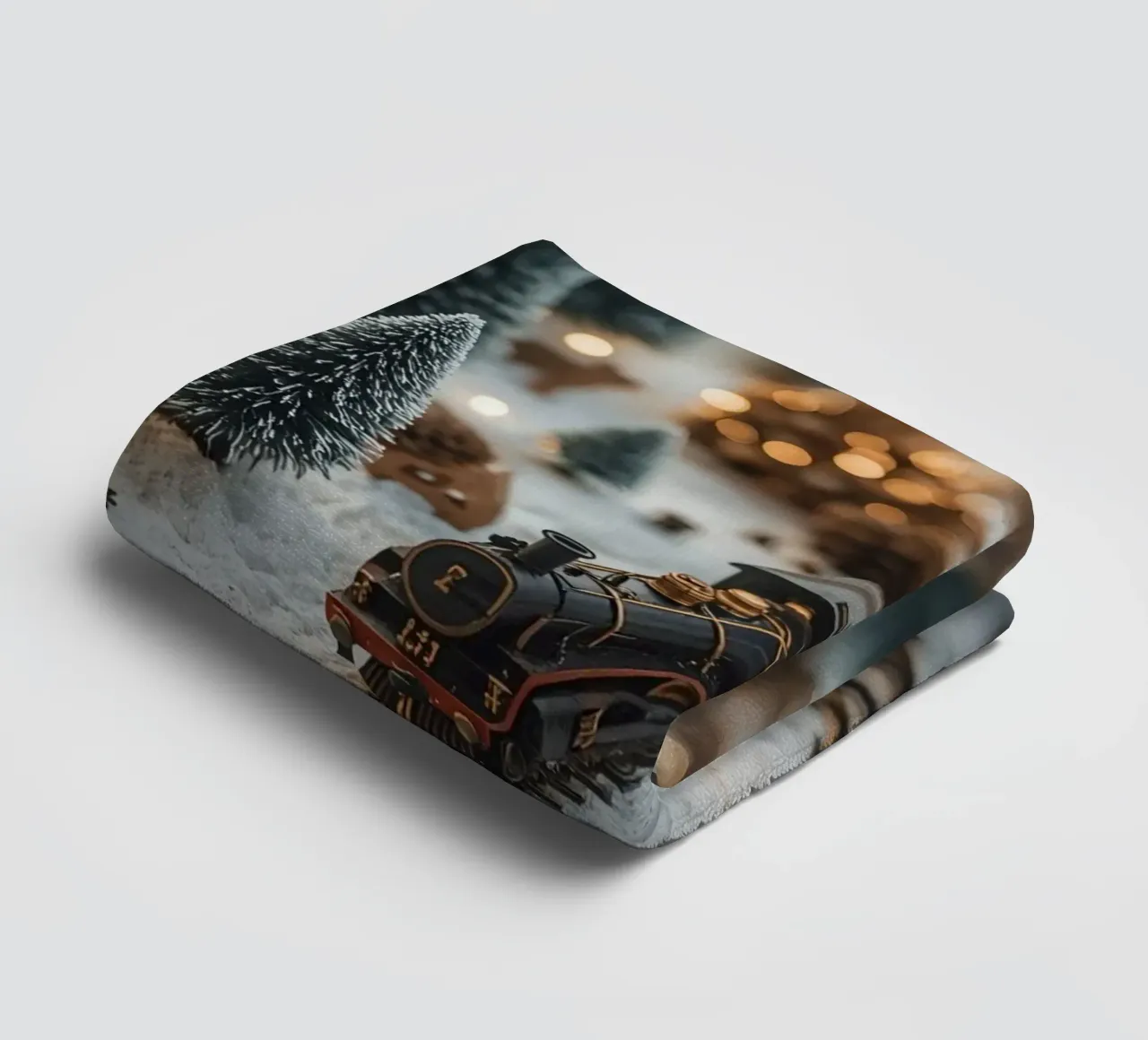 Miniature Train in Snowy Landscape with Trees and Lights towel by DesignDoodle
