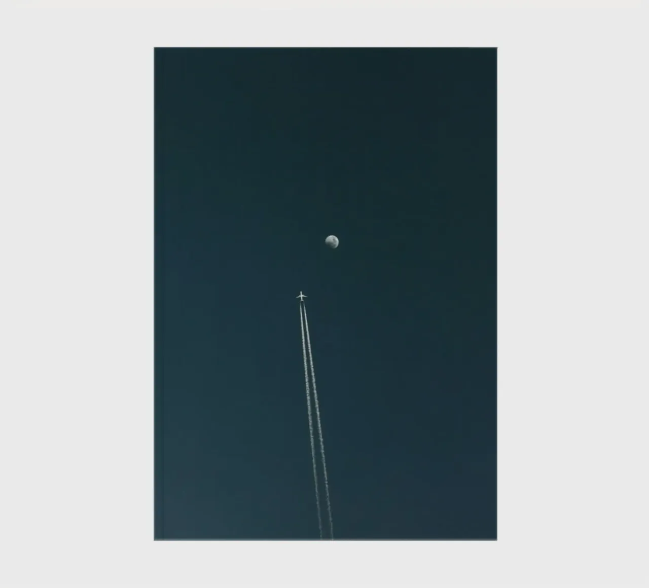 plane with moon notebook by Fost