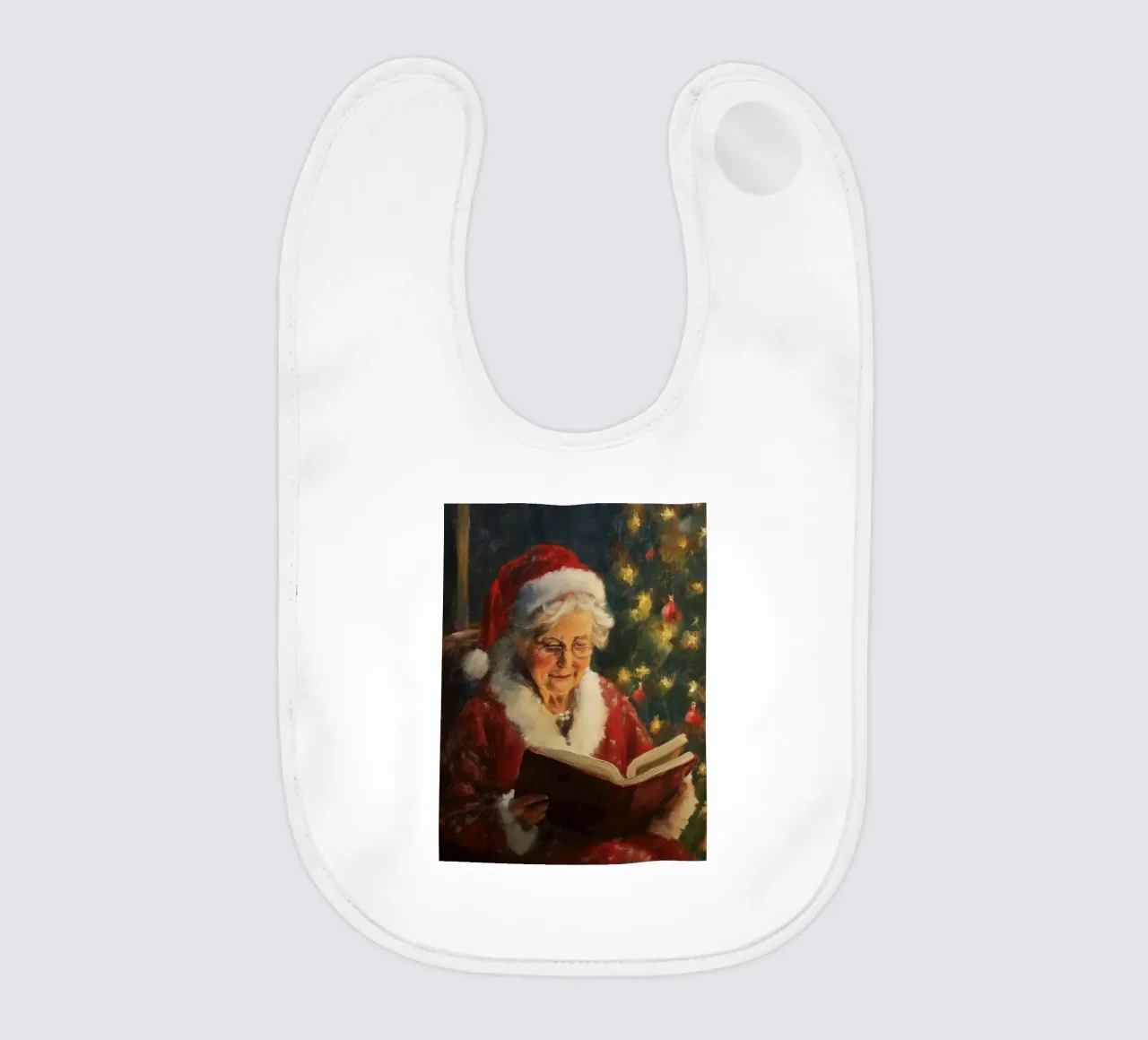 La signora Babbo Natale legge un libro davanti a un albero di Natale in festa bavaglino da Cozy Vibes