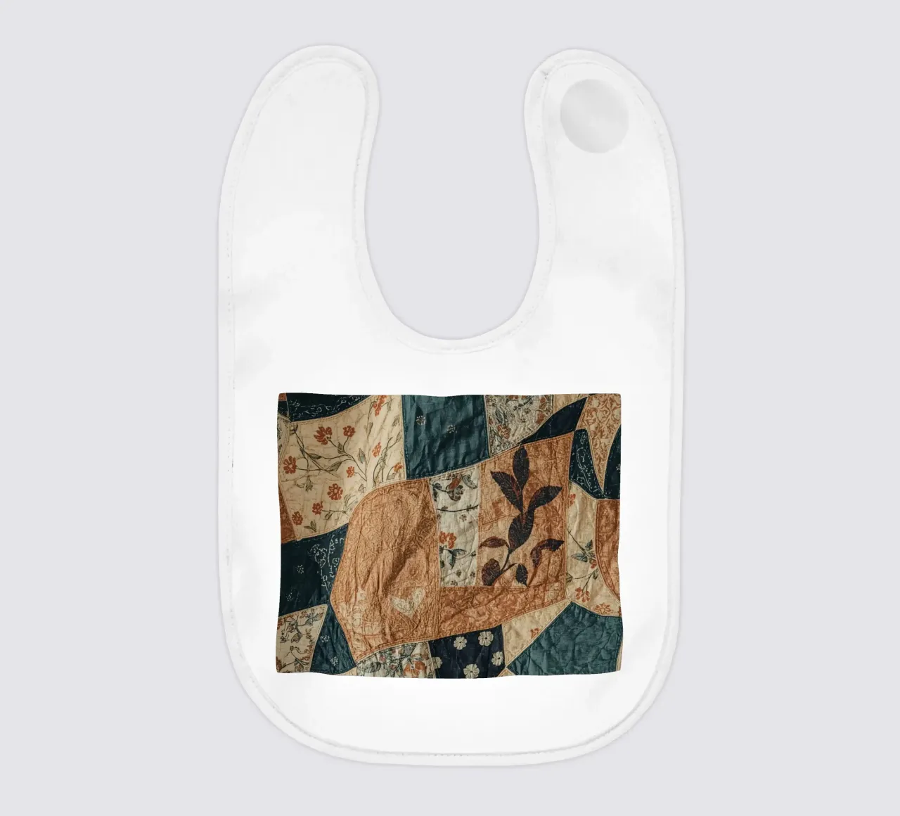 Patchwork Quilt with Floral and Abstract Patterns baby bib by DesignDoodle