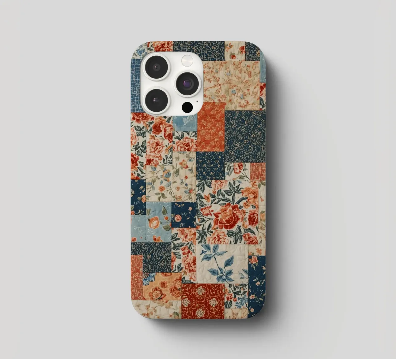 Patchwork-Quilt mit floralen und geometrischen Mustern iPhone Hülle von DesignDoodle