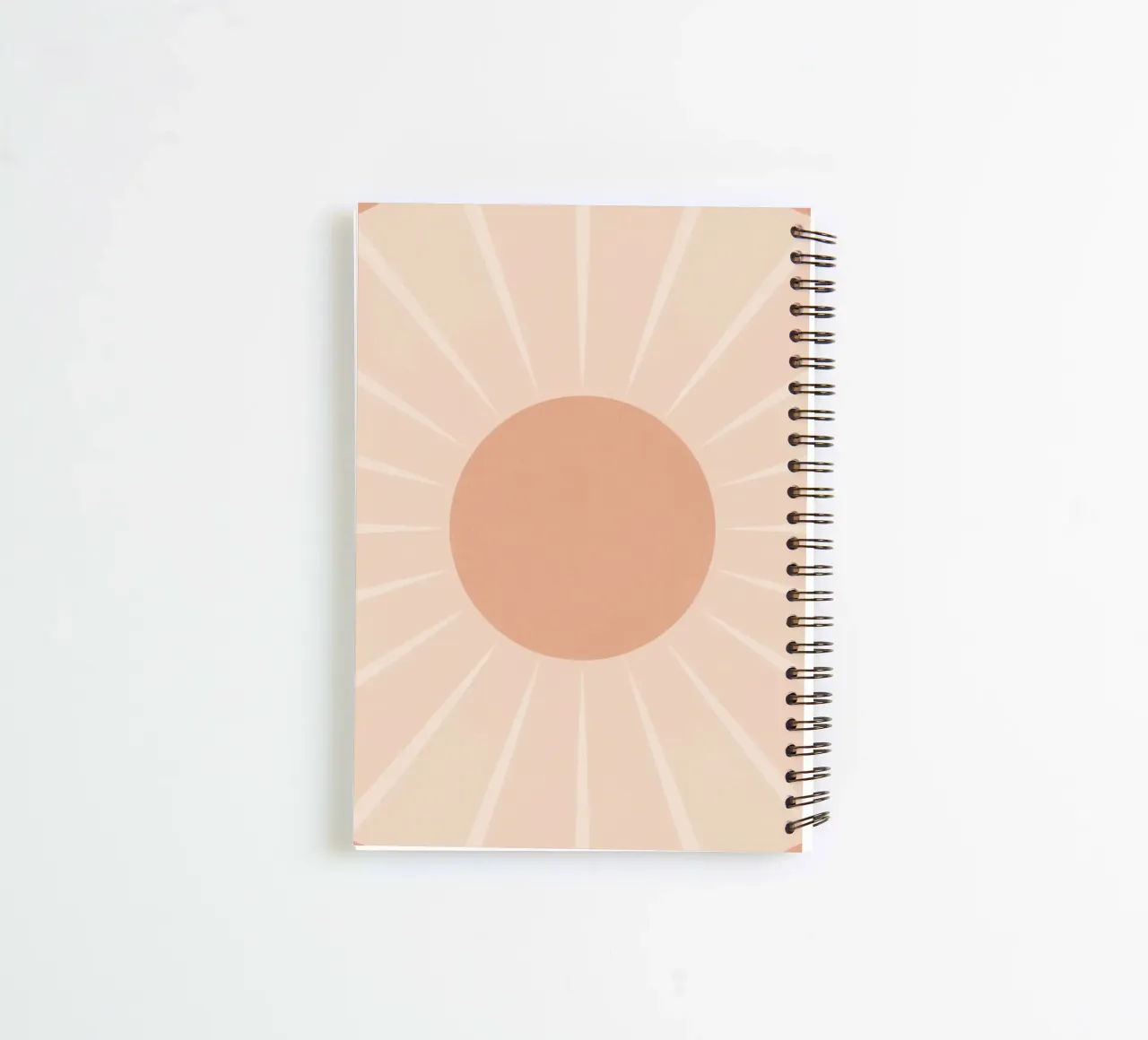 Peach Circle and Rays Background spiral notebook by DesignDoodle