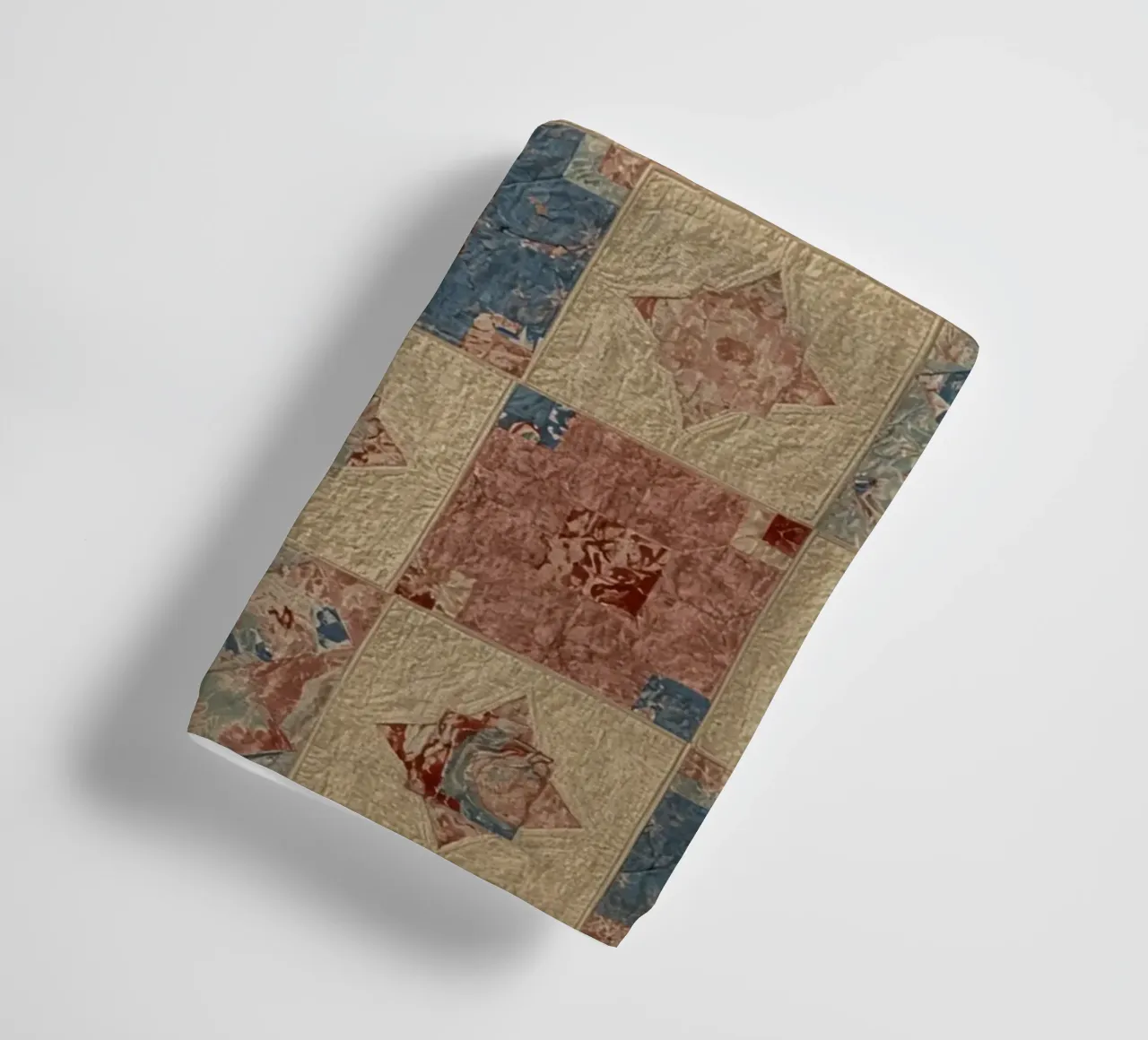 Quilted Fabric with Geometric and Floral Patterns towel by DesignDoodle