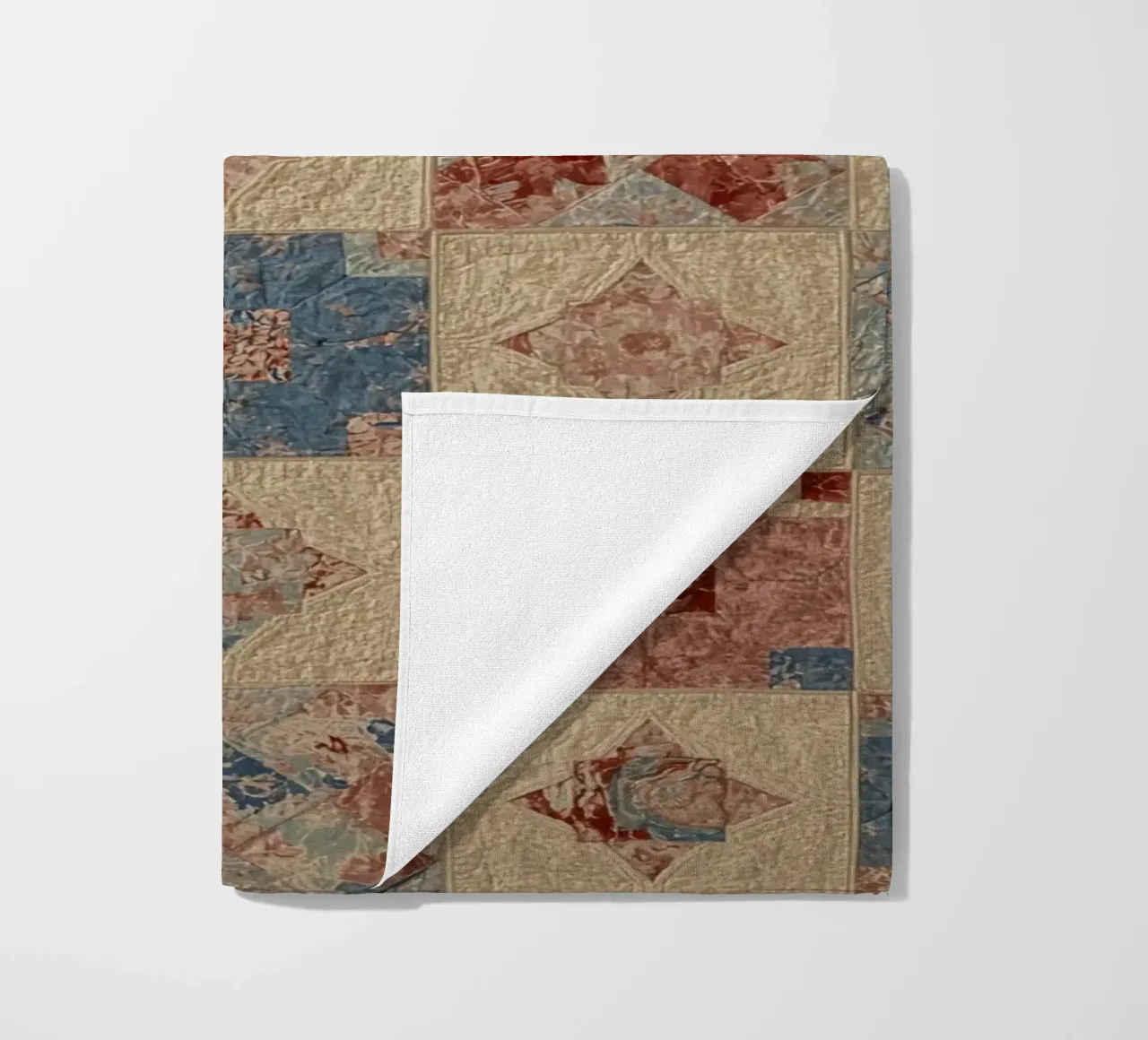 Quilted Fabric with Geometric and Floral Patterns beach towel by DesignDoodle