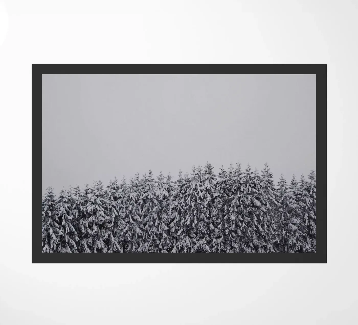 Snow-covered trees doormat by Fjöllart