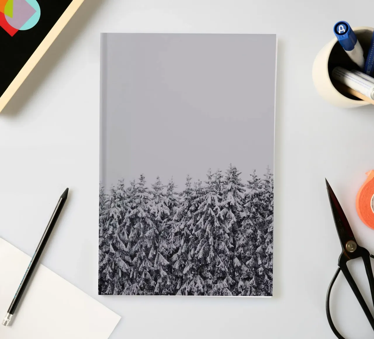 Snow-covered trees notebook by Fjöllart