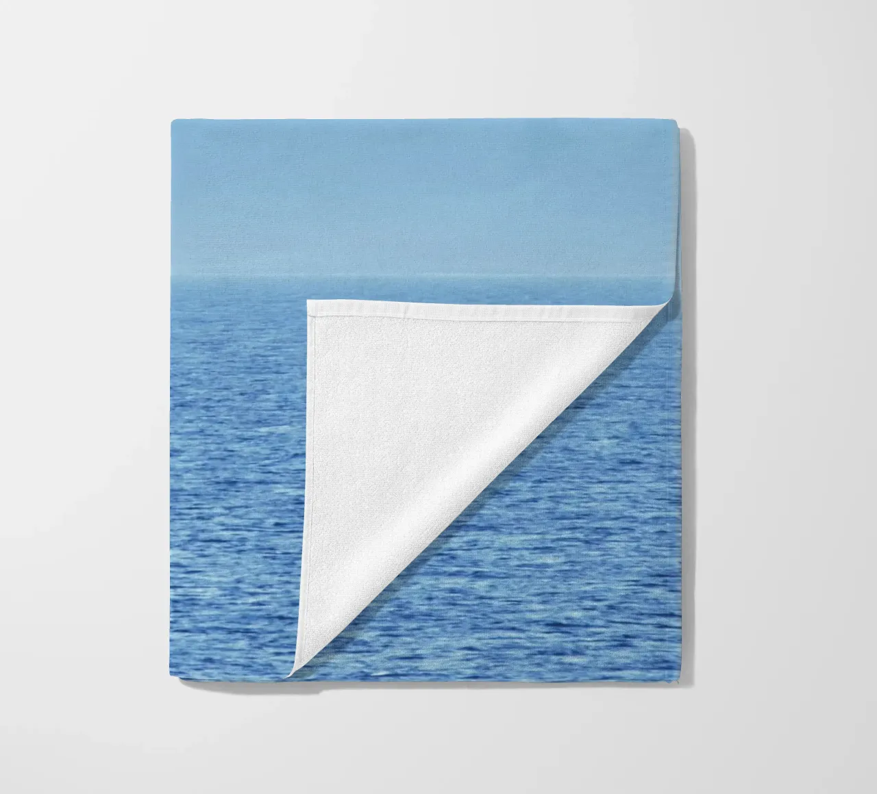 Mountains out of the sea beach towel by Fjöllart