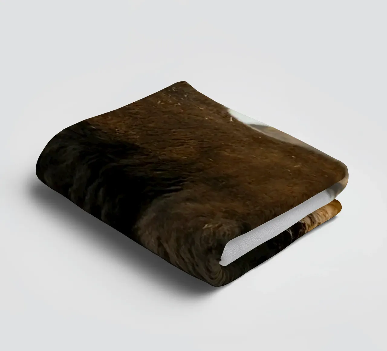 A Yak Grazing on the Slopes of the Himalaya's towel by The Herringstore