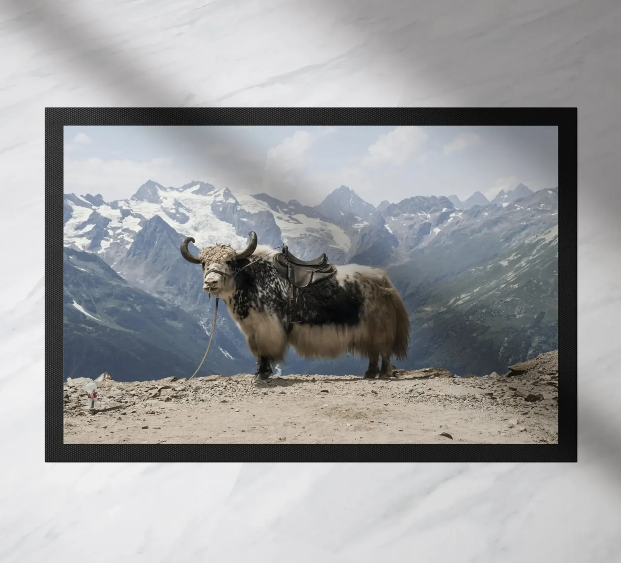Yak Standing on a Snowy Mountain Backdrop doormat by The Herringstore