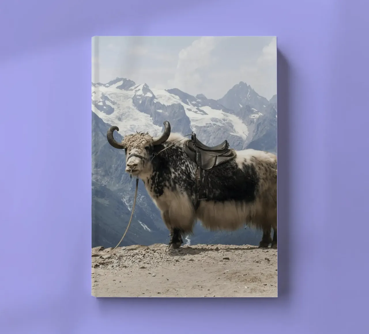 Yak Standing on a Snowy Mountain Backdrop notebook by The Herringstore