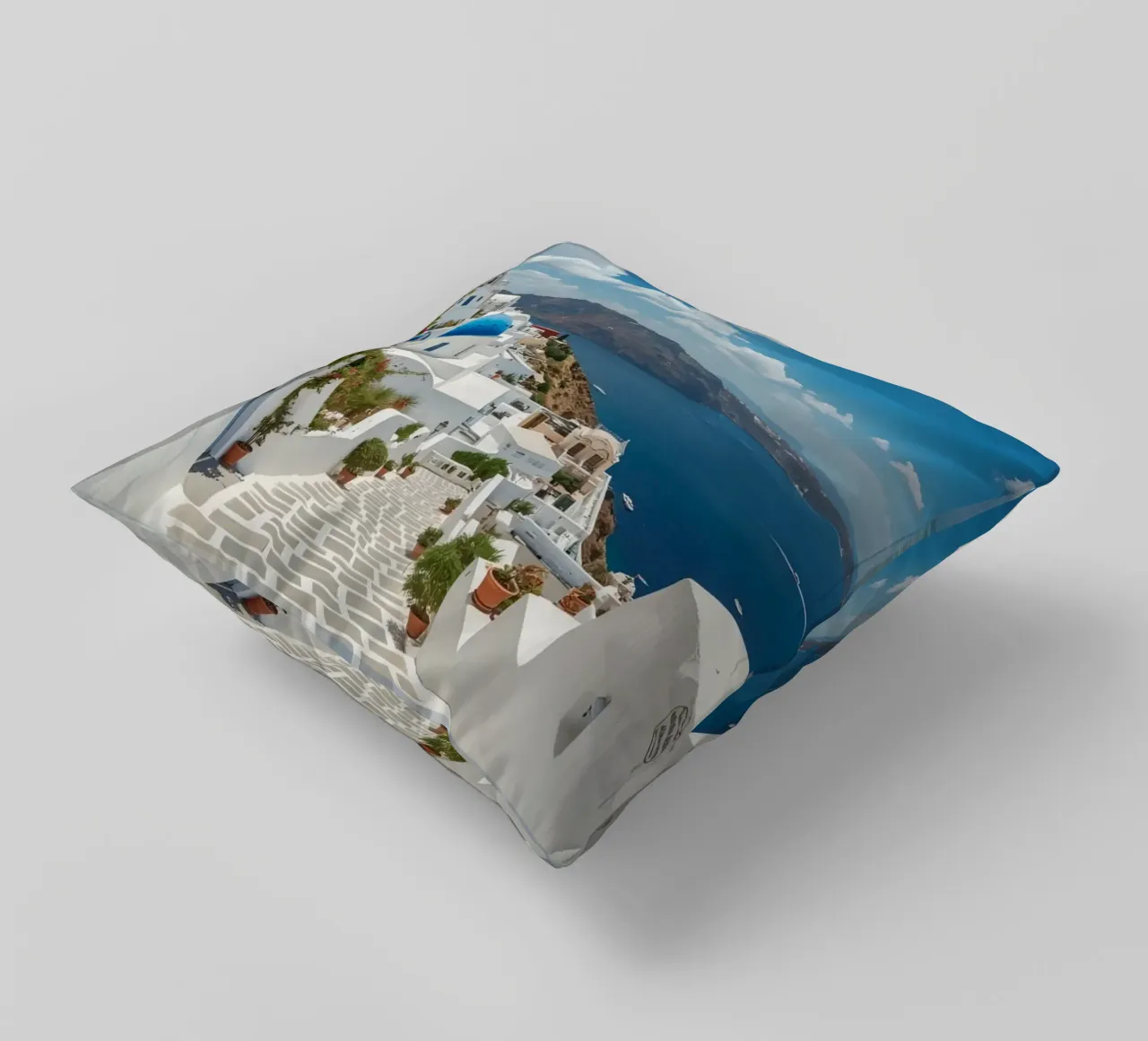 Edifici imbiancati e sentiero di pietra a Santorini cuscino da DesignDoodle