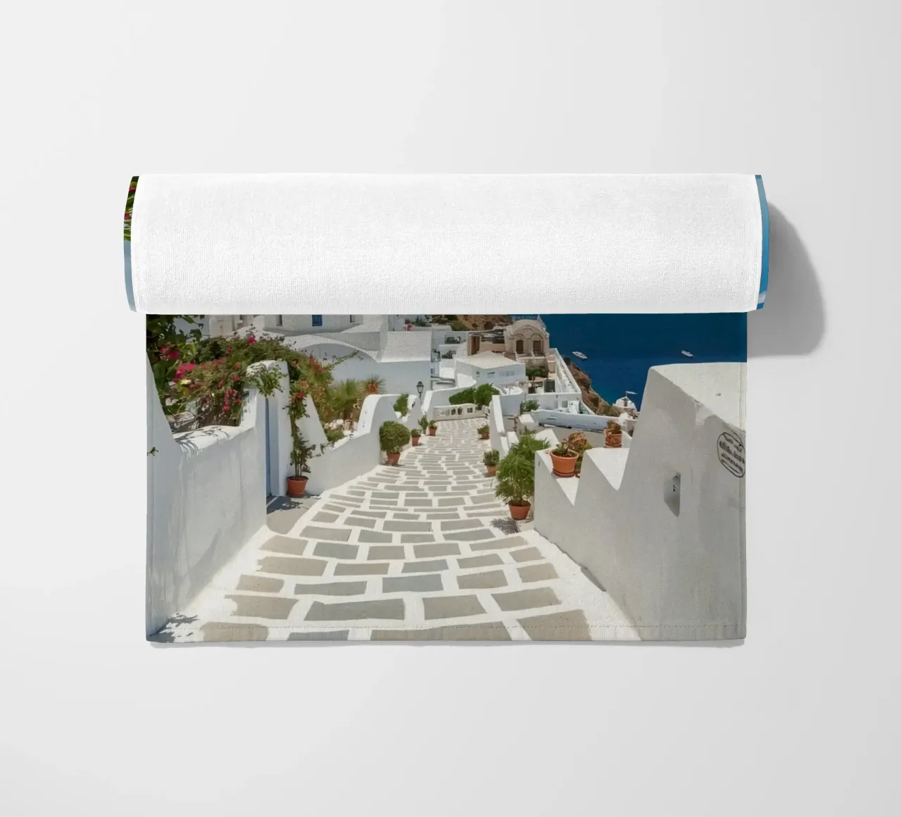 Whitewashed Buildings and Stone Pathway in Santorini beach towel by DesignDoodle