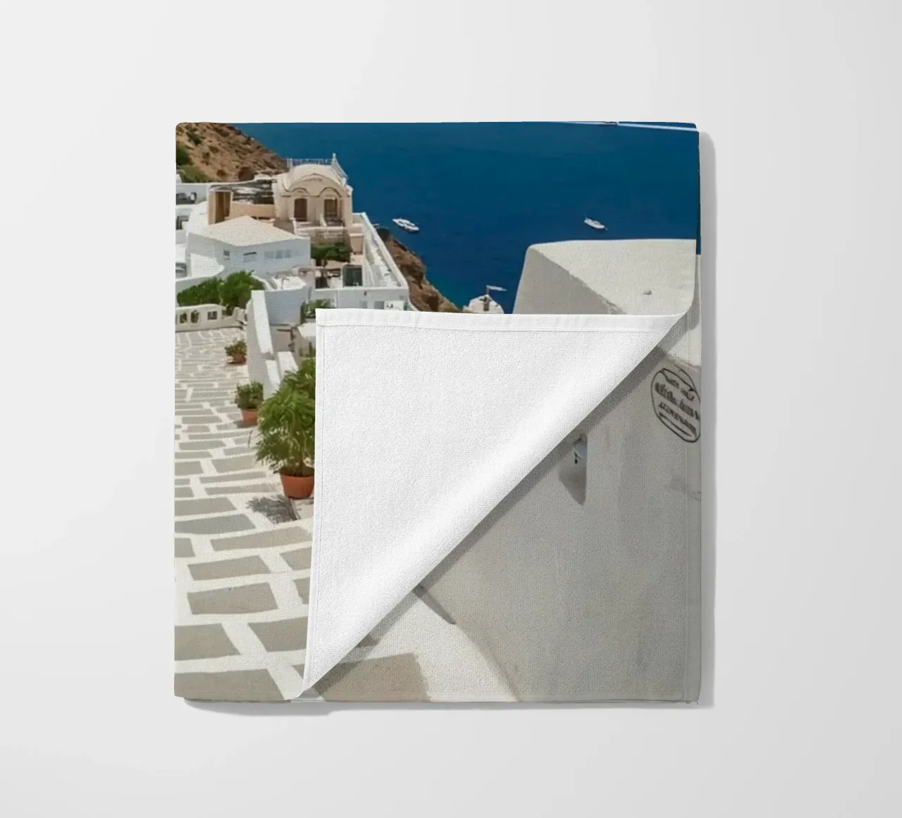 Whitewashed Buildings and Stone Pathway in Santorini beach towel by DesignDoodle