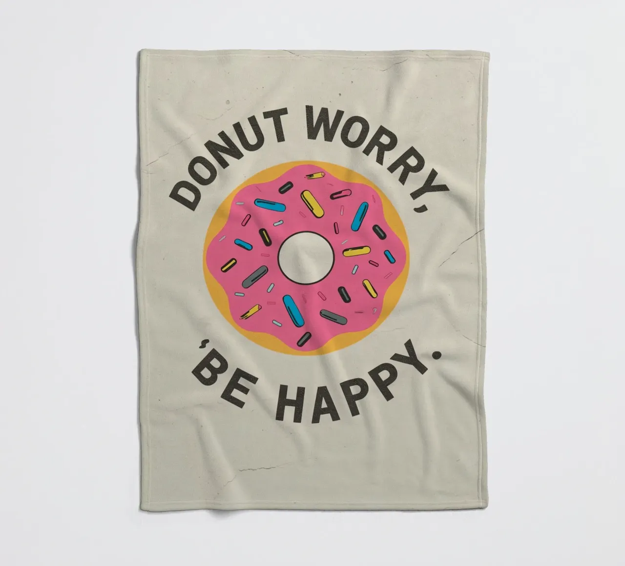 Ciambella con "Donut Worry Be Happy" (Non preoccuparti, sii felice) coperta in pile da DesignDoodle