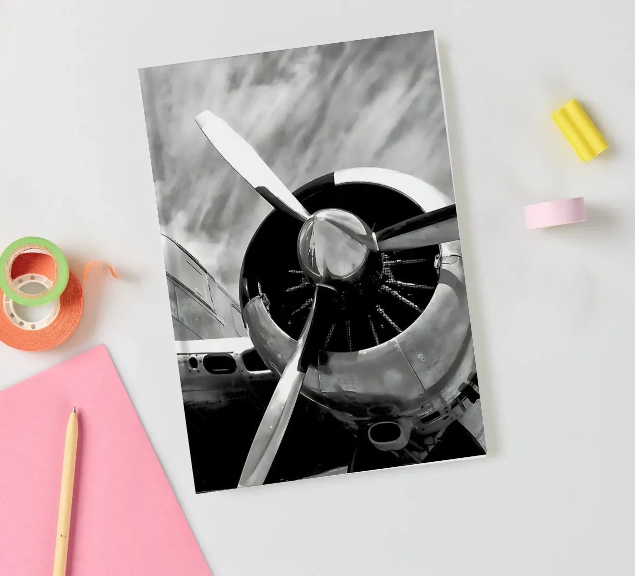 Retro propeller aeroplane in monochrome b&w vintage notebook by DiveDuke
