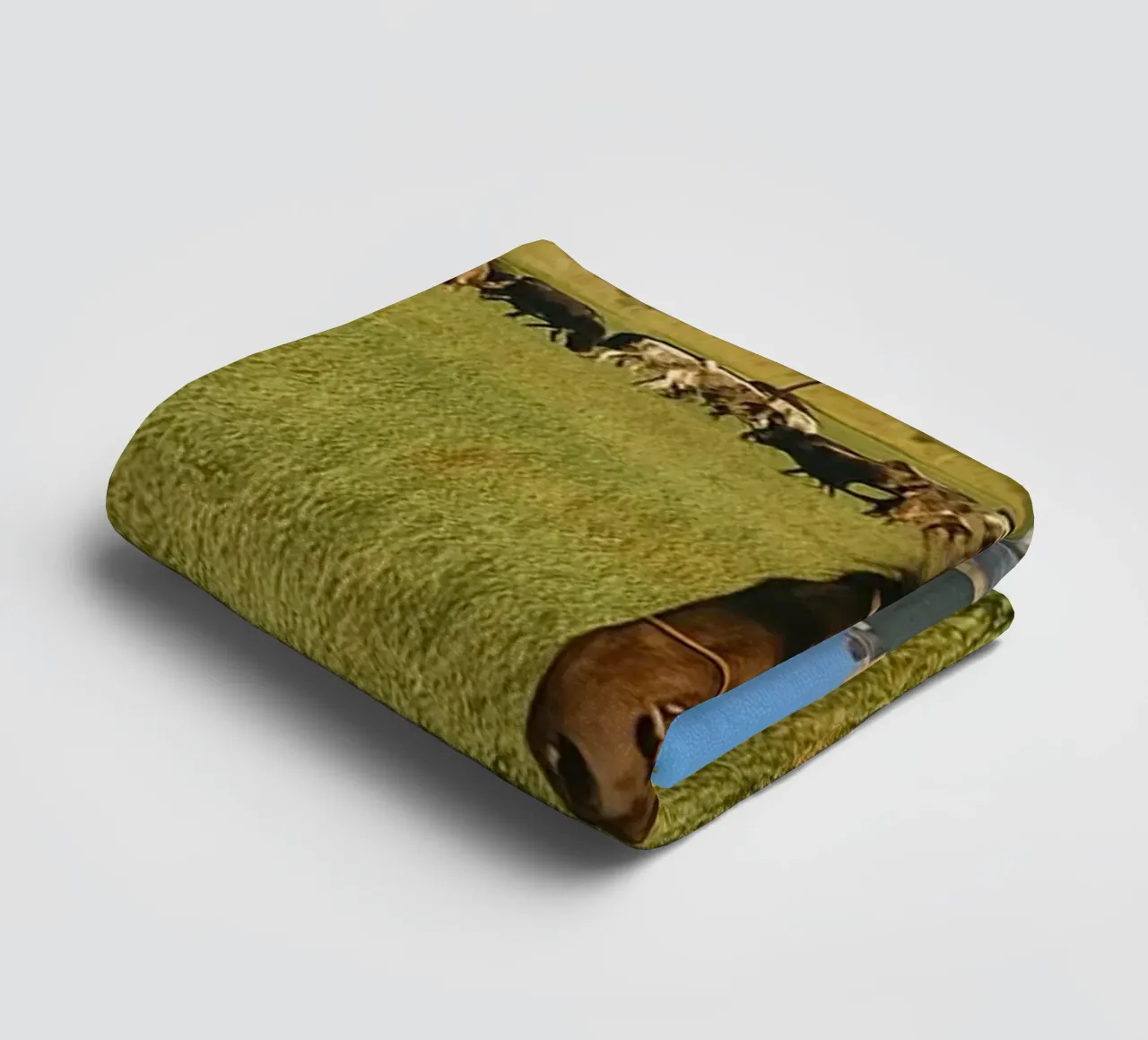 young man herding cows in the meadow towel by tamarind