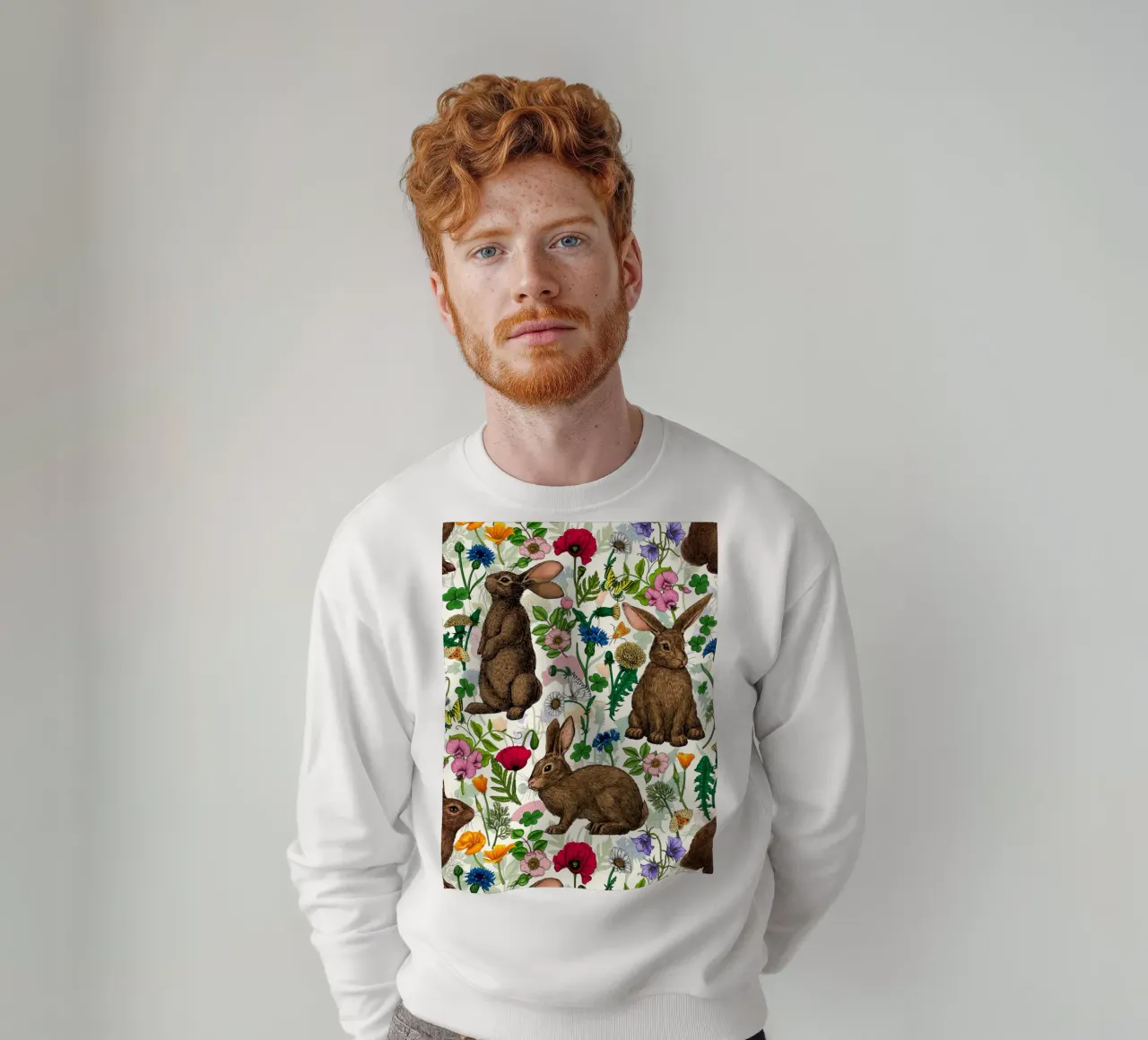 Conigli e fiori selvatici felpa da Painted Nature