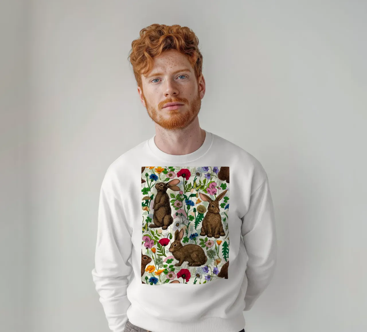Conigli e fiori selvatici felpa da Painted Nature