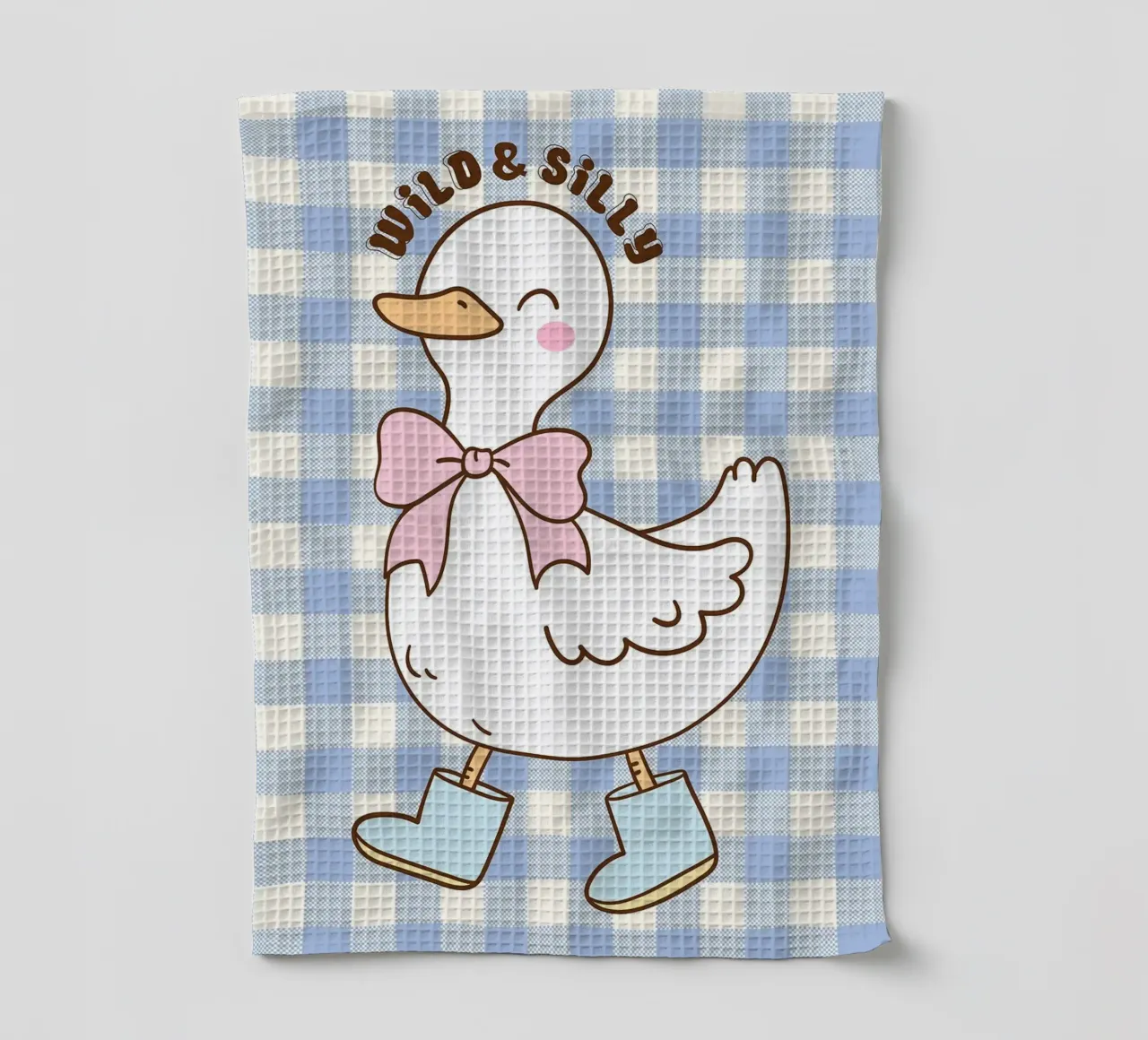 Simpática ilustración de un pato con botas y lazo paño de cocina de Tory