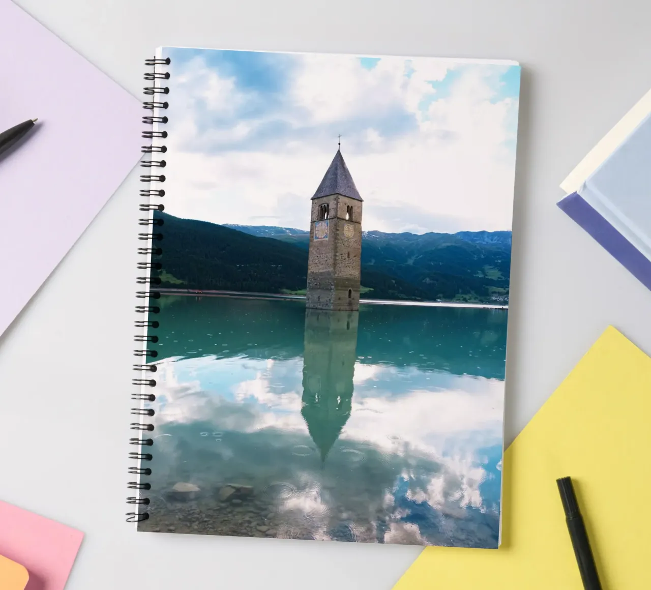 Kirchturm im Reschensee spiral notebook by Fjöllart