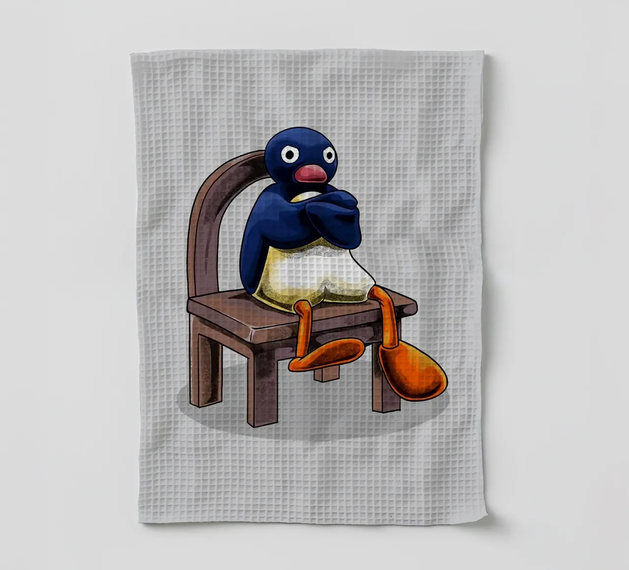 Pingu assis sur une chaise torchon de bazi