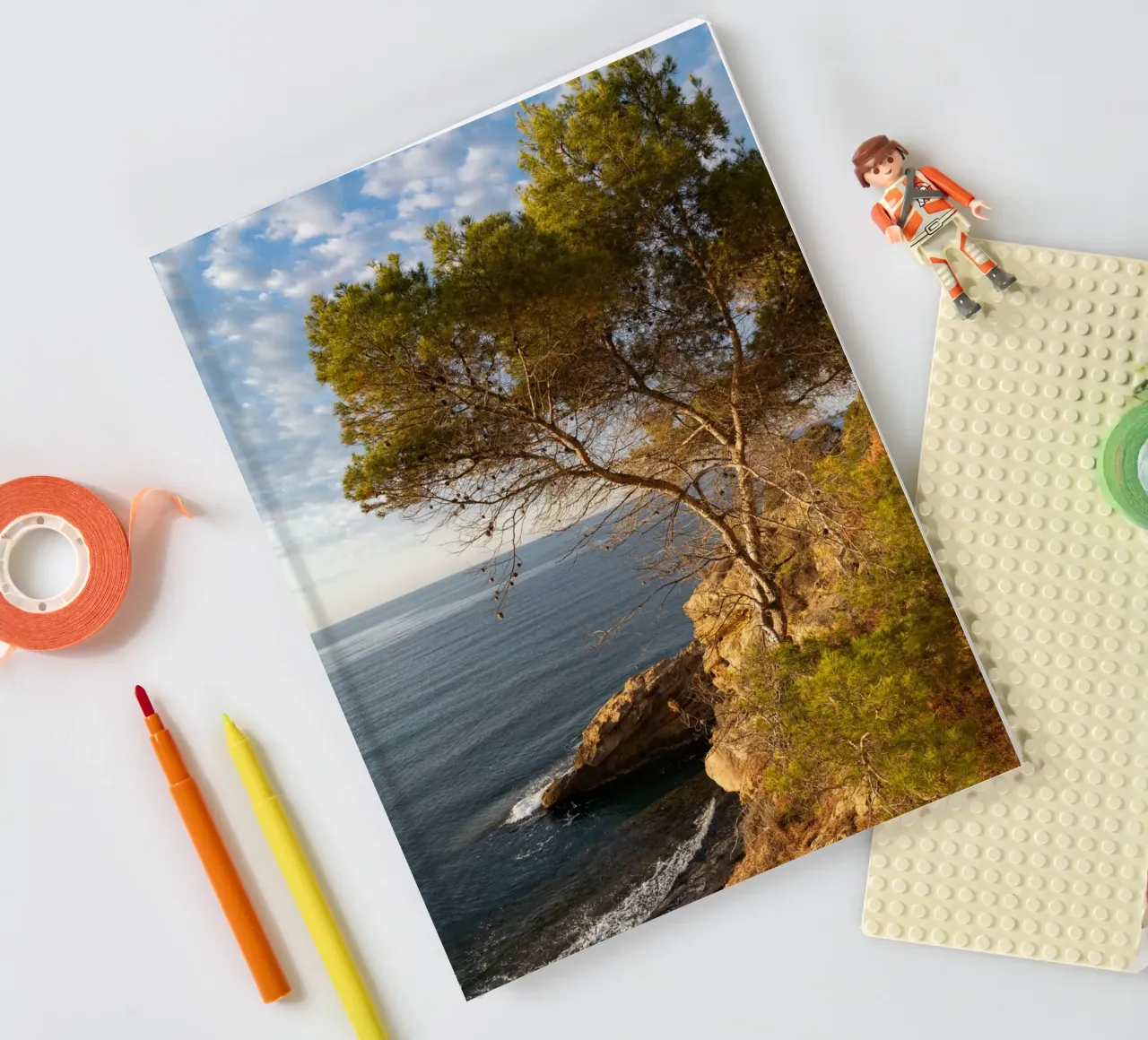 Pine trees and cliffs on the Mediterranean notebook by Adriana Mueller
