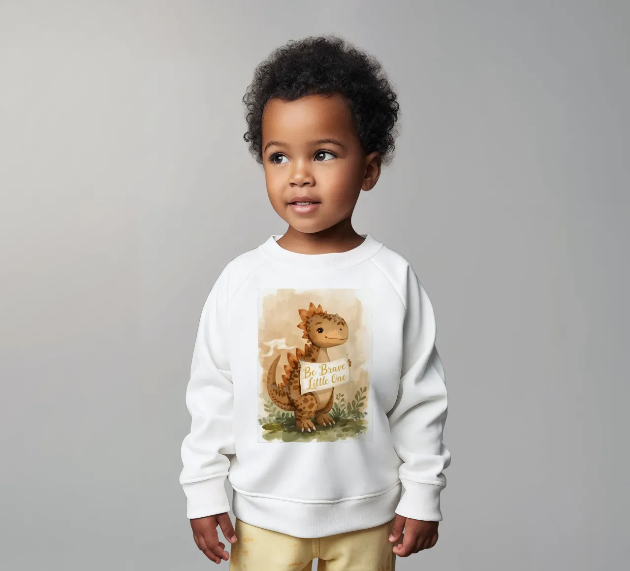Lindo dinosaurio sosteniendo una pancarta " Be Brave Little One ". sudadera de bebé de DesignDoodle