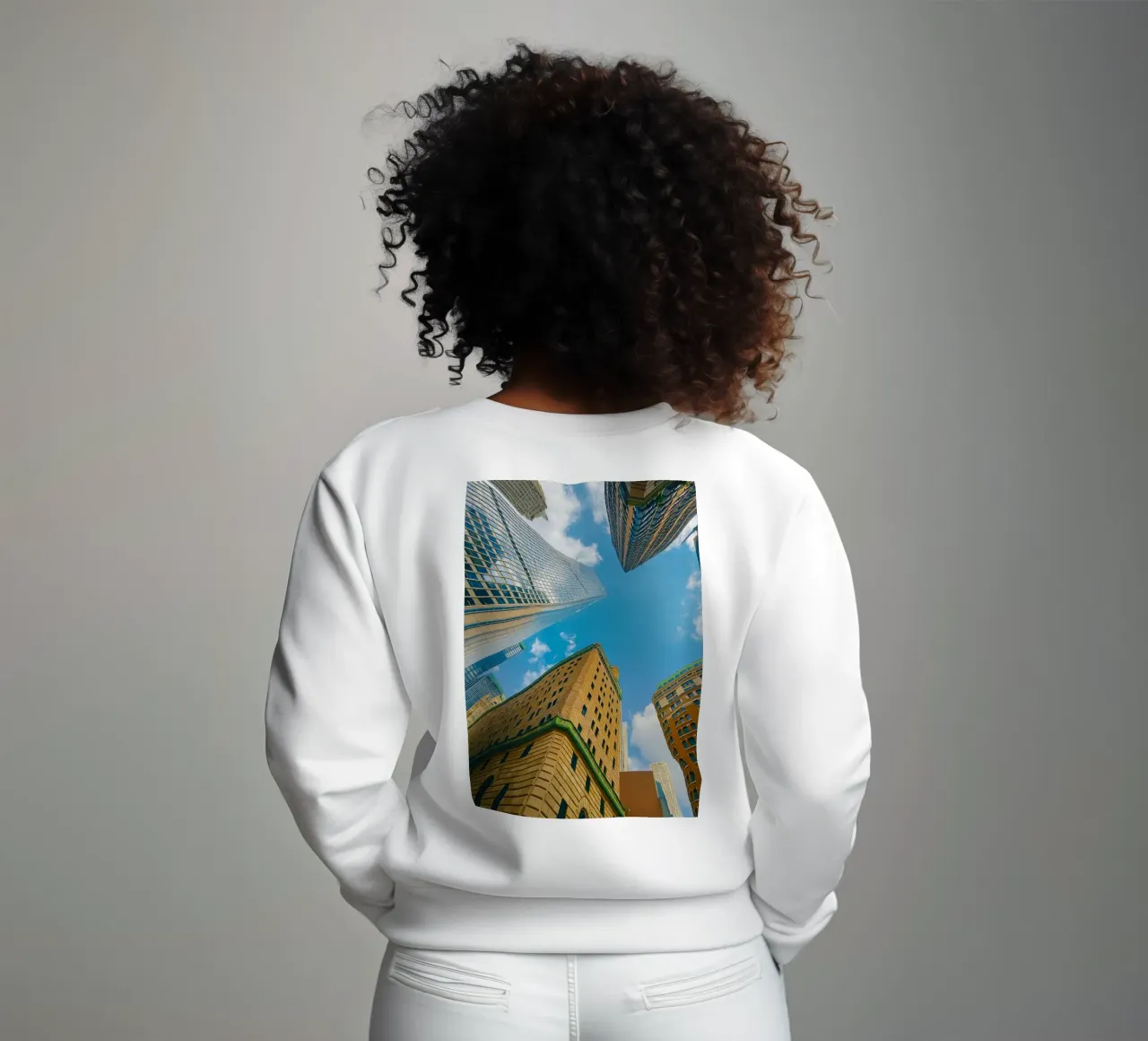 view of the sky from under a tall building sweatshirt by PASMING
