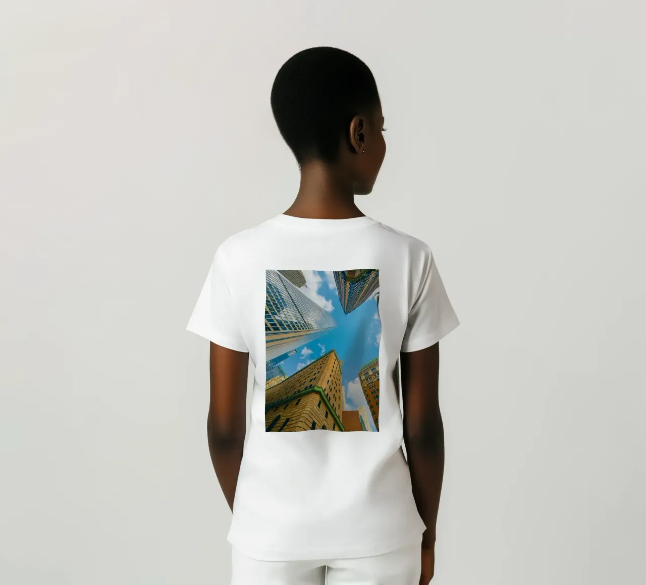 view of the sky from under a tall building t-shirt by PASMING