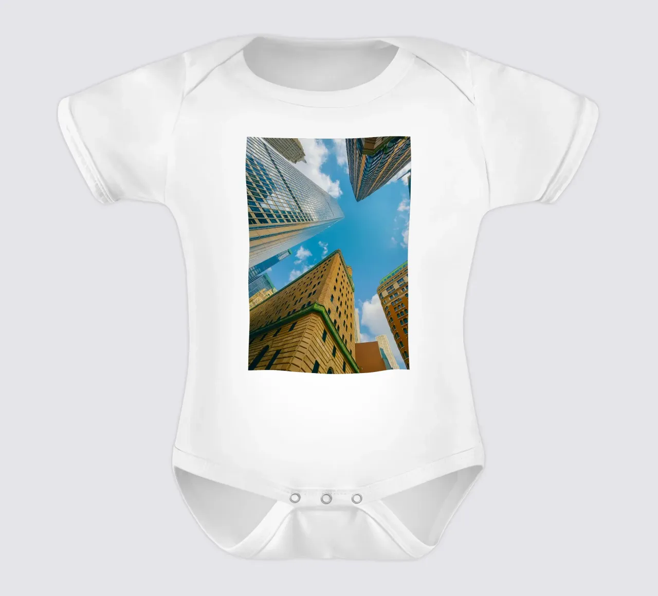 view of the sky from under a tall building short-sleeve baby romper by PASMING